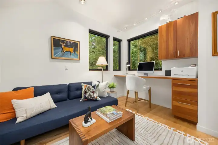 Bedroom number 2 with built-in desk and cabinets.