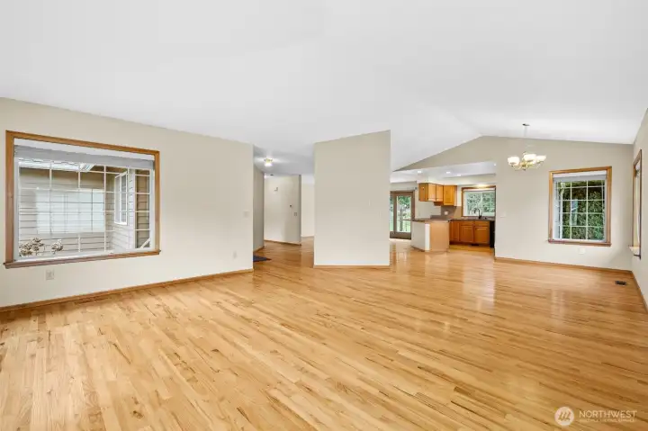 Alternate view of the entry to the left, dining to the right, and kitchen.