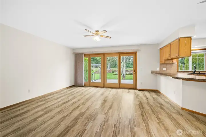 Family room located off the kitchen with sliding doors providing direct access to the backyard.