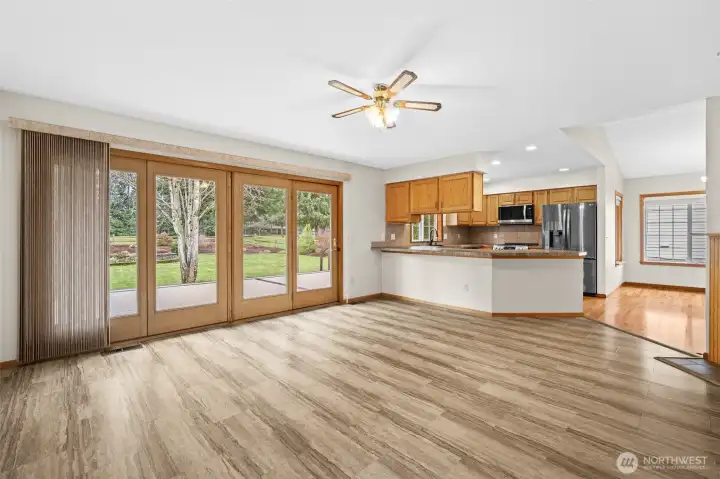 Family room with expansive sliding doors that open to the back yard, view toward the golf course.