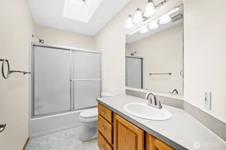 Full bathroom with tub/shower combination.