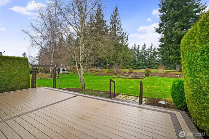 View from the deck overlooking the fairway and landscaped backyard.