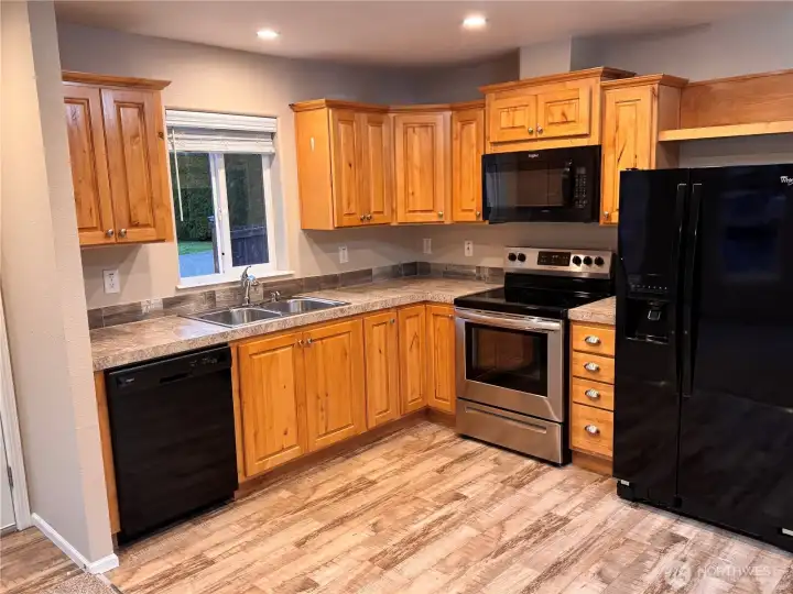 Light-filled kitchen with efficient layout and modern appliances.