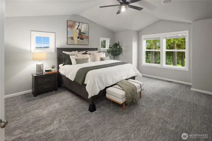 Huge Primary Suite with vaulted ceilings overlooking the golf course