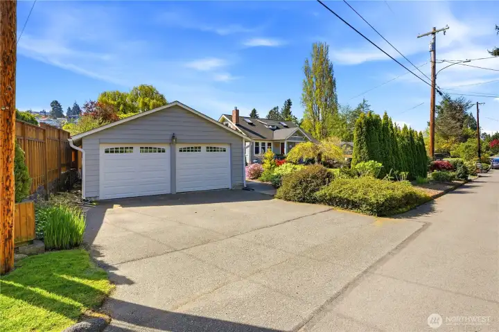 Two-car detached garage and more parking on the other side of the house.