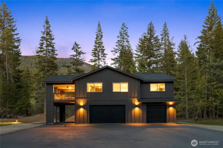 Beautiful lighting on this home and thought out the yard.