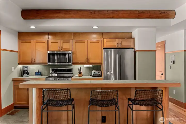 Sit at the kitchen bar area to chat with the cook or grab a snack before exploring.
