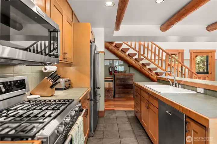 Under stairwell storage area. Outfitted with everything you need to use the home, right now.