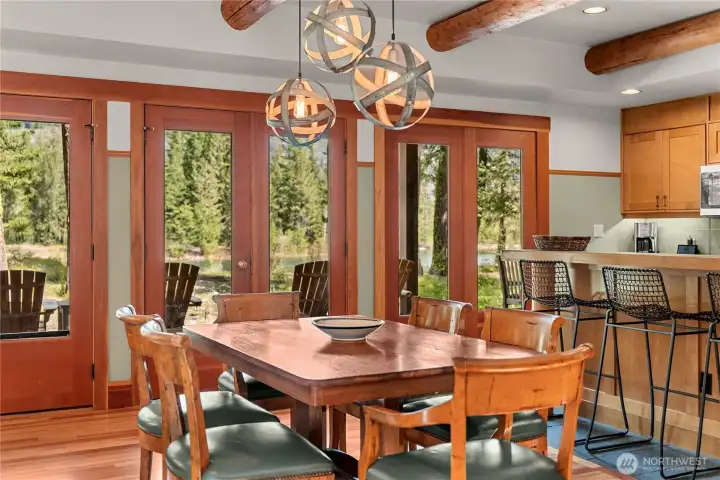 Doors from the dining room open to a charming lakeside porch, perfect for enjoying the view and fresh air.