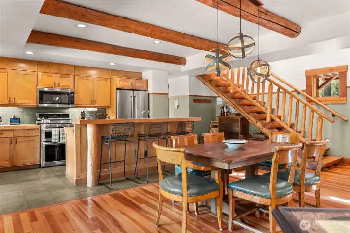 Vertical grain fir and slate flooring. These materials offer a blend of natural textures and durability, with the fir providing a warm, inviting look and the slate adding a touch of sophistication and resilience.