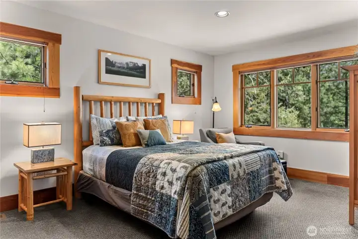 Three bedrooms, each featuring an ensuite bathroom, offer both privacy and convenience for all occupants.