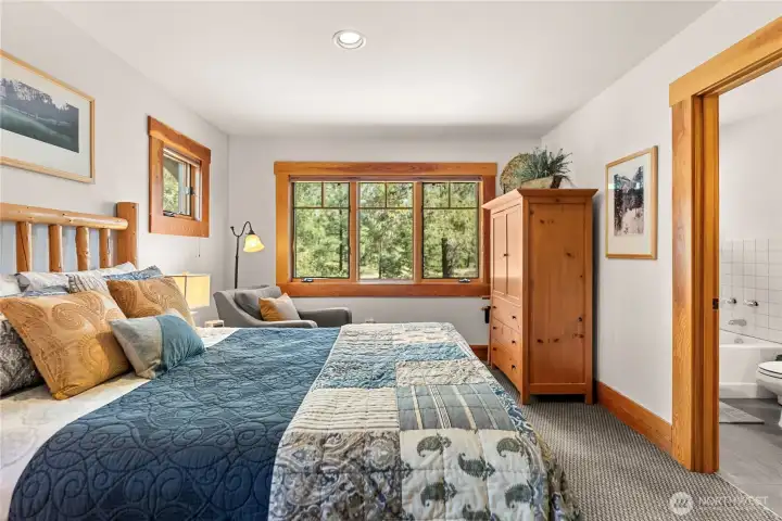 Storage, artwork, and refined bedding are featured in all bedrooms.