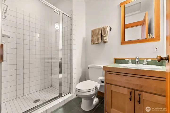 Third bedroom's ensuite 3/4 bathroom with tiled shower.