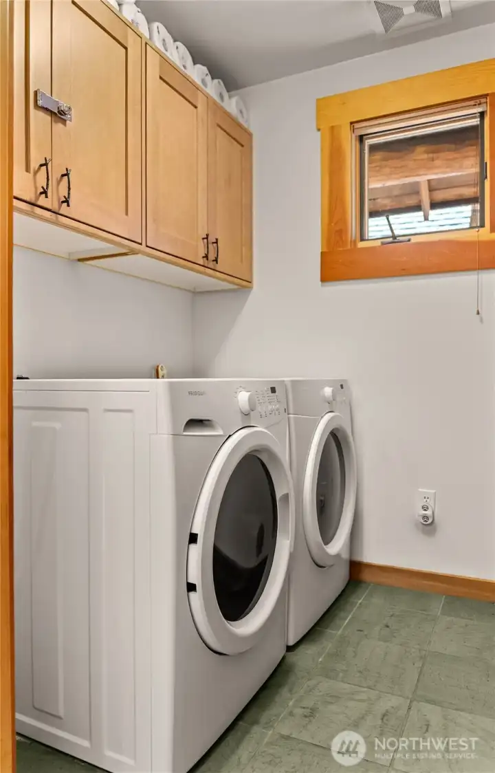 The laundry and utility room are accessible from the entryway.