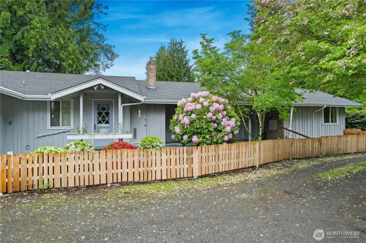 11805 196th with a beautiful wood fence at the front of the house.