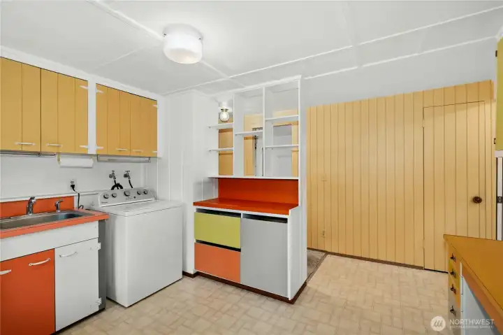 lots of cabinets and storage with a sink.