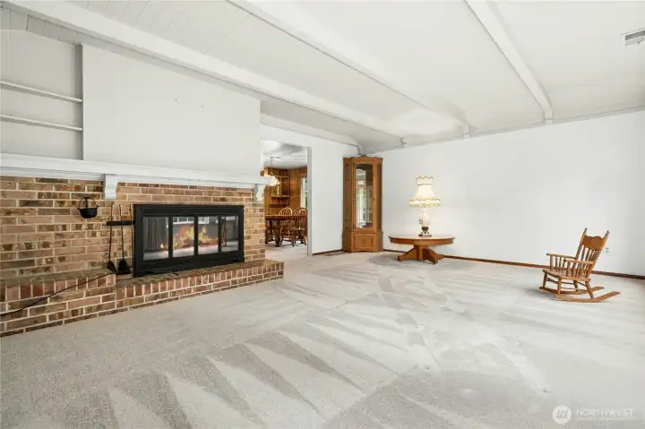 Living room off the dinning room. Wood burning fireplace