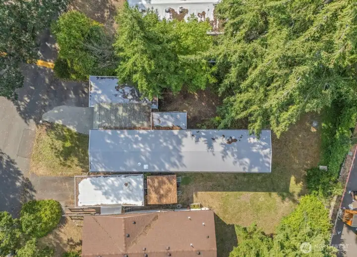 Drone view above the house showing the new roof Drone view above the house showing the new roof