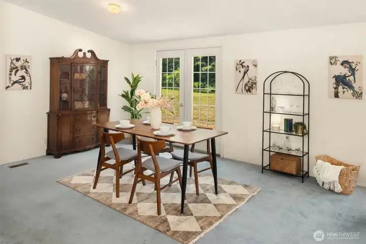 Dining area has French doors out onto the north side of the home.