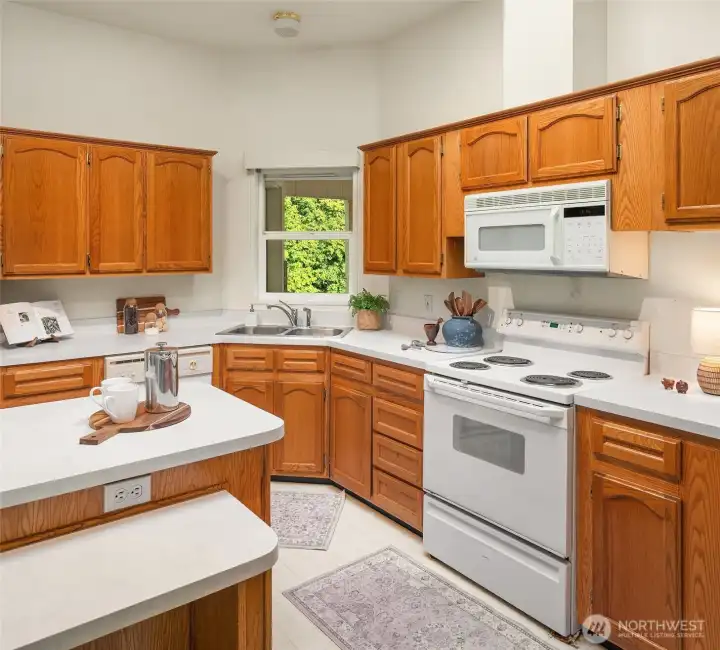 Kitchen is generous and easy-care with so much storage for food and dishware.