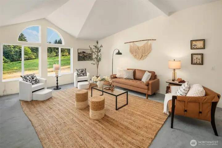 Family room is adjacent to kitchen with big south-facing windows, vaulted ceilings and tons of room.