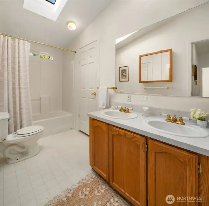 Second full bath has access from mud entry and from bedroom hallway.