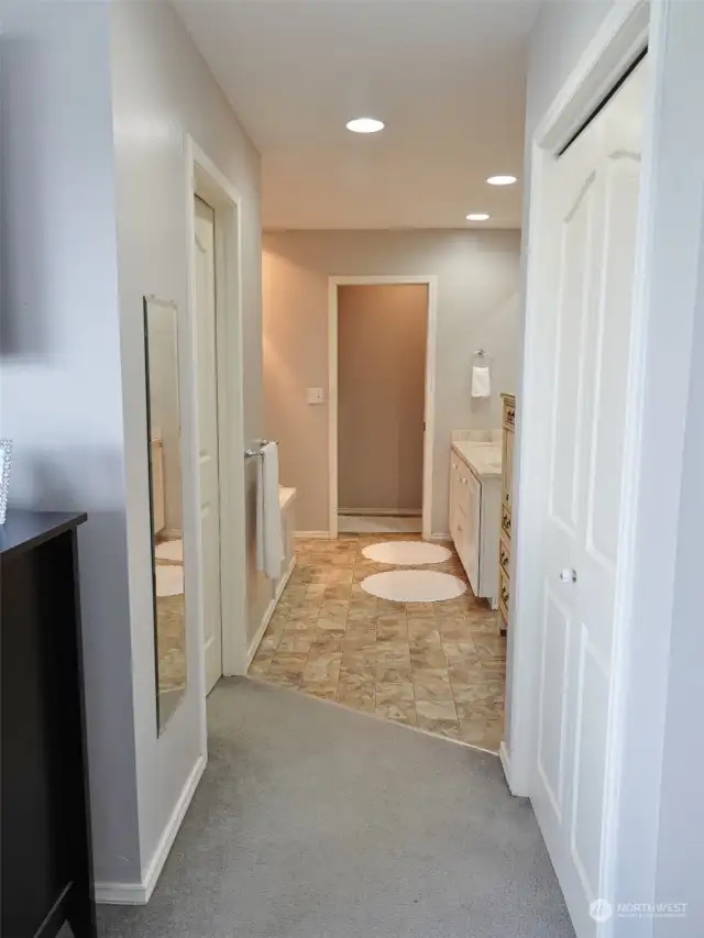 Leading from the Master Bedroom into the Master Bathroom. Closets on both sides.