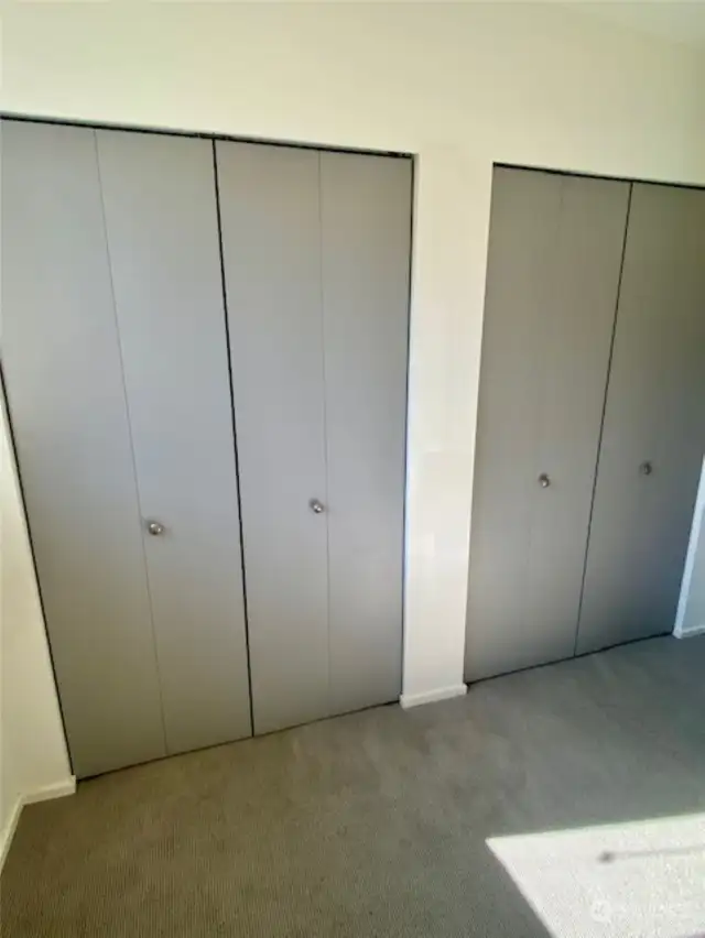 Double closets in primary bedroom.