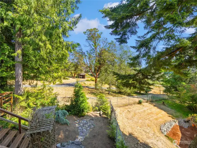 View of the neighbors yard beyond the fence