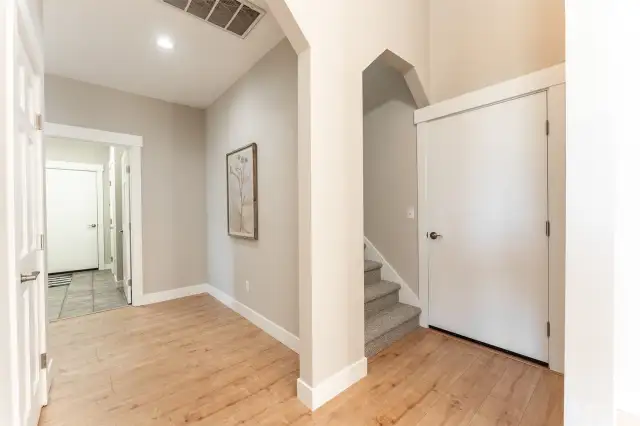 Doorway to right is from the 2 car garage. The one to the left is to the 1 car garage thru the utility rooom.