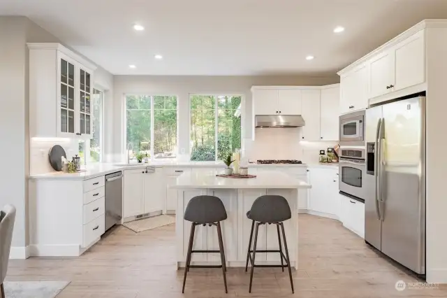 New appliances, countertops and doors to cupboards.