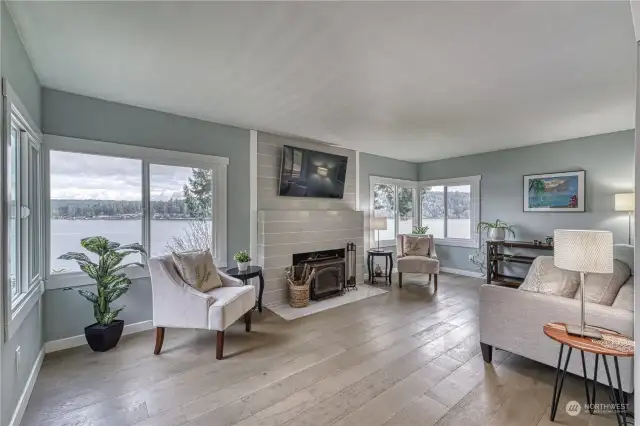 Living room with beautiful views out of all the windows.