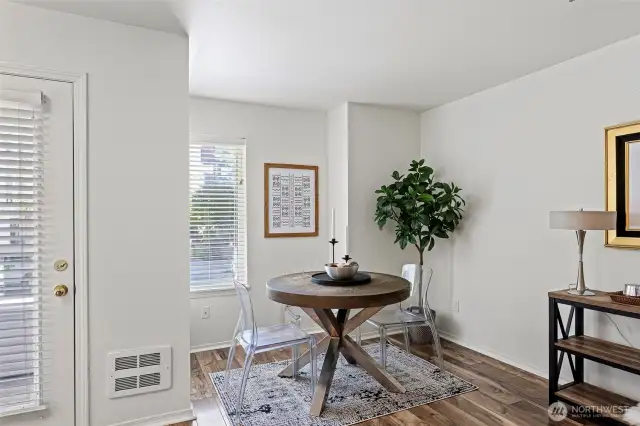 Dining nook with natural light flooding into this wonderful Ballard unit.