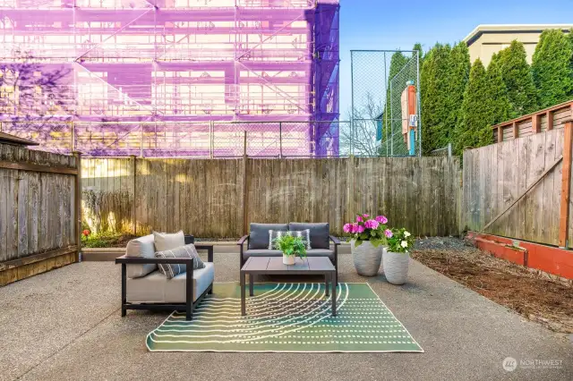 Holy smokes!! This space is all for you! Patio with flower beds surrounding. Fully fenced.