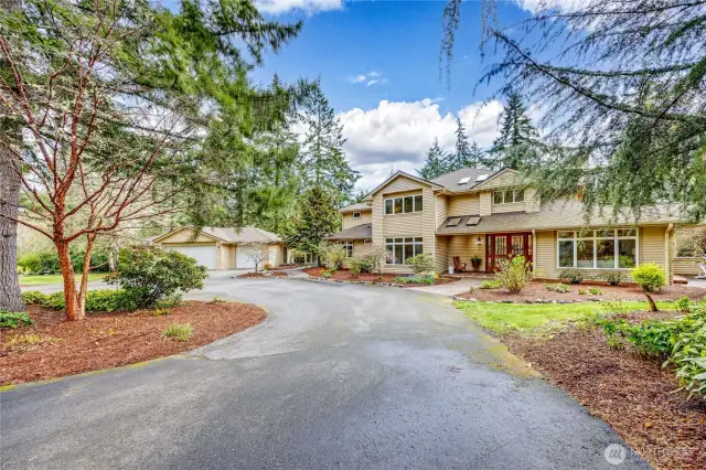 Welcome home to 11150 Fairmont Lane NE. Custom home sited on 7.38 private  acres in the desirable Meadowmeer area.