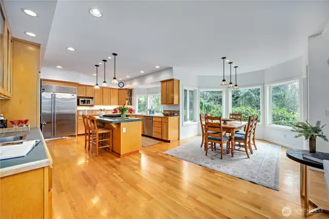 A Chefs' kitchen like none other! Custom oak cabinets, abundant storage, two oversized pantries, a breakfast bar and stainless appliances. Double oven, Sub-zero and a wet bar.