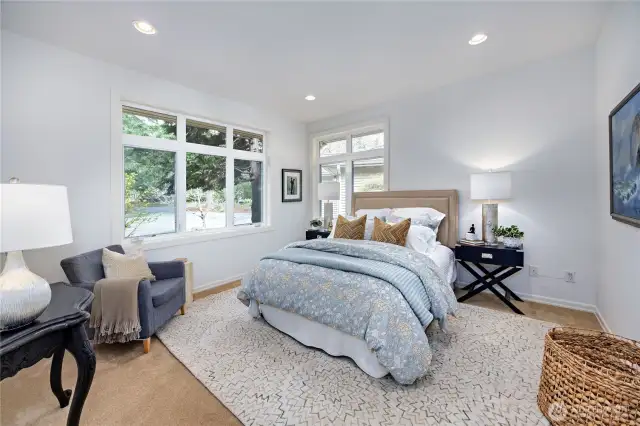 Main level bedroom with lovely garden views.