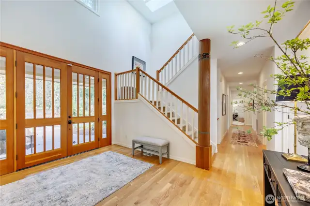 Enter into the beautiful foyer and you're embraced by the beauty and warmth of this well designed PNW home. Rich in texture and wood, and natural light streaming in from all sides.