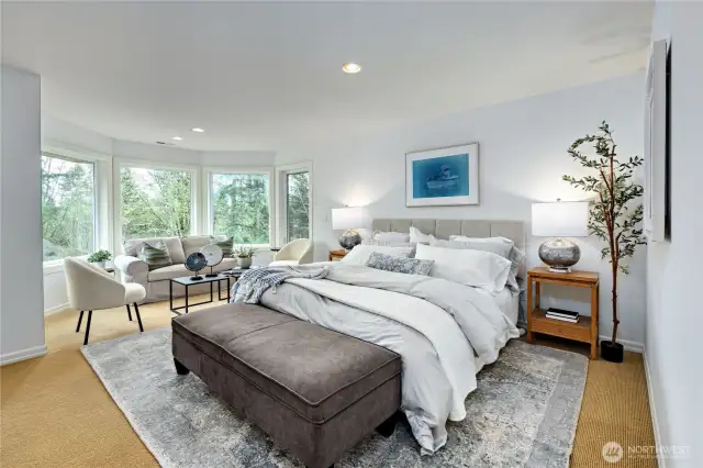 The luxurious Primary suite features a bay window and spacious enough for a sitting area.