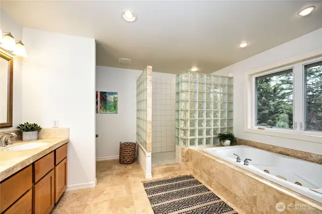 The primary bath features spa-like amentities. You'll enjoy the jetted tub, easy access shower and dual vanities.