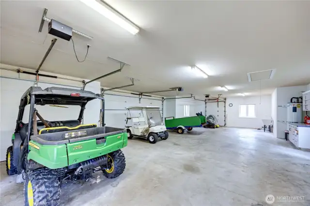 Unbelievable space in this three car + golf or tractor parking space. The garage is equipped with 220 power and water and utility sink for convenience.