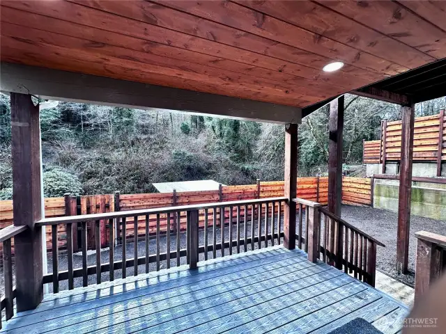 Back Deck Directly off Living Room, Surronded by Cedar Privacy Fence. Grass Seed will be planted before closing.