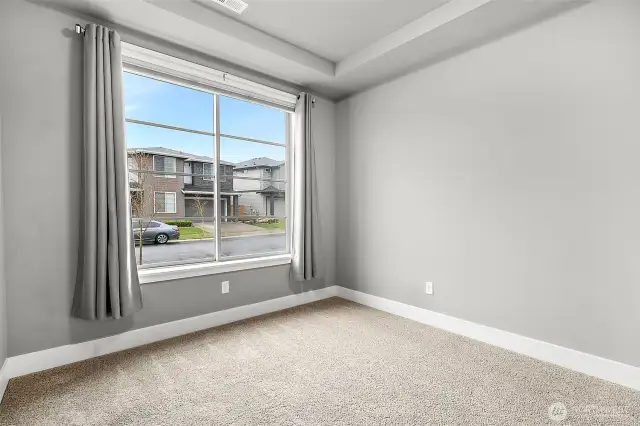 A bright, cheerful office showcasing a spacious window.