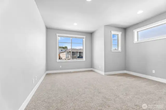 Loft brimming with possibilities-its open layout invites creativity, with ample space for relaxation, work, or play. lg windows flood the room with natural light, creating a bright and welcoming atmosphere.