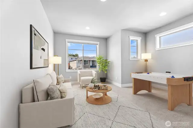 Loft brimming with possibilities-its open layout invites creativity, with ample space for relaxation, work, or play. lg windows flood the room with natural light, creating a bright and welcoming atmosphere.