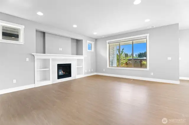 Cozy fireplace indoor and out, with neutral tones throughout-perfect for customizing to your style!