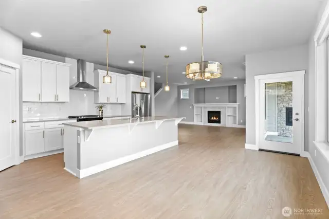 Ample dining space, with massive kitchen island and breakfast nook looking out on to the beautiful Tehaleh trails.