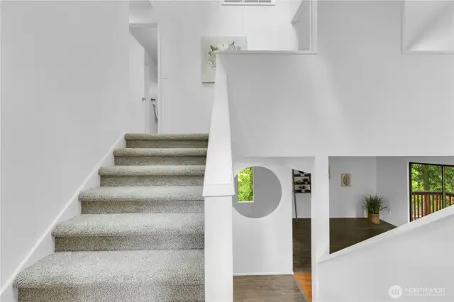 Stairs up from entry to bedrooms