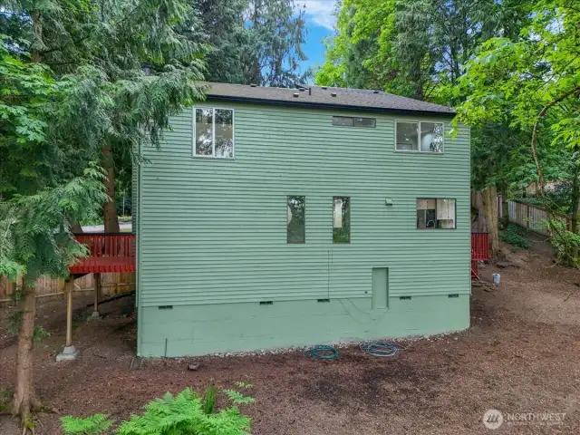 Back of house. bottom door leads to storage space the length of the house