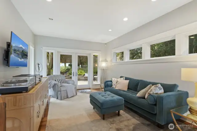 Movie nights, Mariners games and fun await in this awesome family room! Easily flow out to the patio through here as well - perfect for summer BBQs and garden parties.